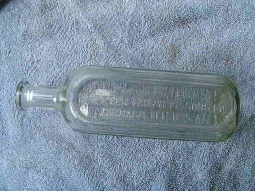 A 9&quot; antique bottle of home use medicine marked Dr. Peters Kuriko from Fahrney &amp; Sons of Chicago.
