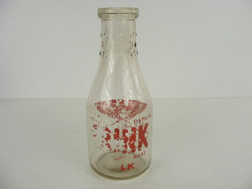 A well worn old Frink Dairy of Denver milk bottle quart.