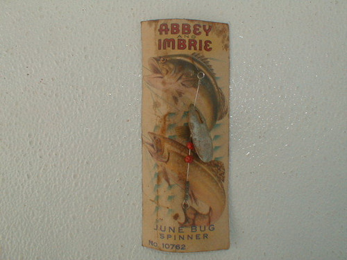 This is an antique Abbey and Imbrie june bug spinner #10762 showing rust but still on its original card and dates to the 1920s or earlier.