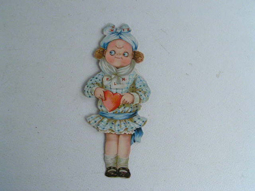 This cute antique mechanical valentine reads he loves me he loves me not when you turn her head over and is 11.5&quot; tall.