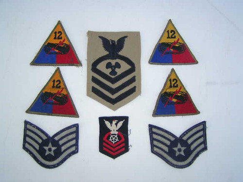 This is an assortment of eight vintage US military issue uniform patches including four from the 12th armored division.