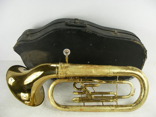 This old brass tuba is marked Olds Ambassador with a Conn case.We assume someone polished the bell as the rest is tarnished with some wear.The valve caps also have wear with the serial #119507 and the overall length is 33&quot;.