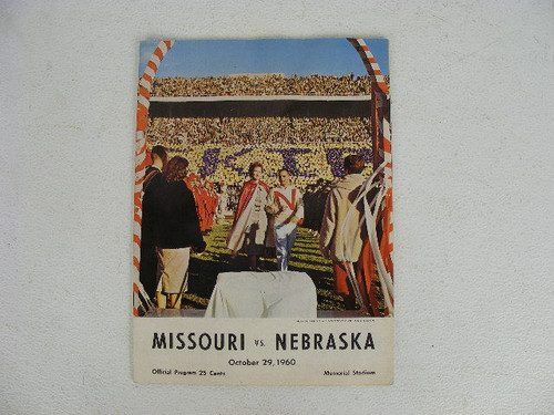 A vintage football program from the Nebraska Cornhuskers versus Missouri Tigers college football game in 1960 featuring players with advertising from Studebaker,7Up,Phillips 66 and Winston.