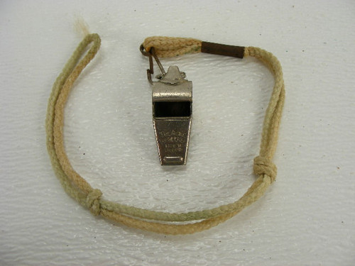 A vintage sports whistle marked Acme Thunderer from Rawlings.