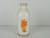 A square vintage quart milk bottle from Wheatridge Farm Dairy out of Denver,Colorado.