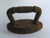 A small rusty antique miniature toy iron that measures 3&quot; long.