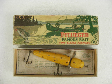 This old wood fishing lure is a Pflueger Globe and it comes with the  original box.This large lure was probably used for Musky fishing as it  measures over 5" long and the box 8 1/2" long. - Antique Mystique