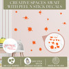 Splatter and Splotches Wall Art Vinyl Stickers Easy Room Decor, 13pc — Orange splatter decals on a pastel pink wall in a