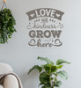 Love Kindness Grow Here Wall Art Sticker Quote Decal — Gray wall art with the words "Love and Kindness Grow Here" above a