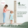 Linen Beige Canvas Height Ruler Growth Chart Wall Art Sign — Wooden growth chart ruler hanging on a wall beside a mother and