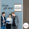 Funny Adulting Definition Canvas Sign Modern Gift Decor Idea — Three professionals discussing a document in front of a gray