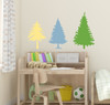 Evergreen Tree Wall Decals Woodland Nursery Wall Stickers 3pc — Three colorful tree silhouettes on a light wall above a
