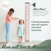 Ribbons Bows Canvas Growth Chart Height Ruler Sign — Wooden growth chart displayed on a wall, child with caregiver measuring