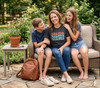 Mama Graphic Tee Tshirt, Heather Gray — Woman sitting on a sofa with two children, wearing casual t-shirts in a garden