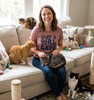 Just Girl Who Loves Cats Comfy Pet Lover Tee for Women T-Shirt — Woman in a pink shirt sits on a beige sofa with four cats