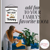 Gardening Dirt Cheap Therapy Canvas Wall Hanging Print — Woman tending to a potted plant in a modern living room with framed