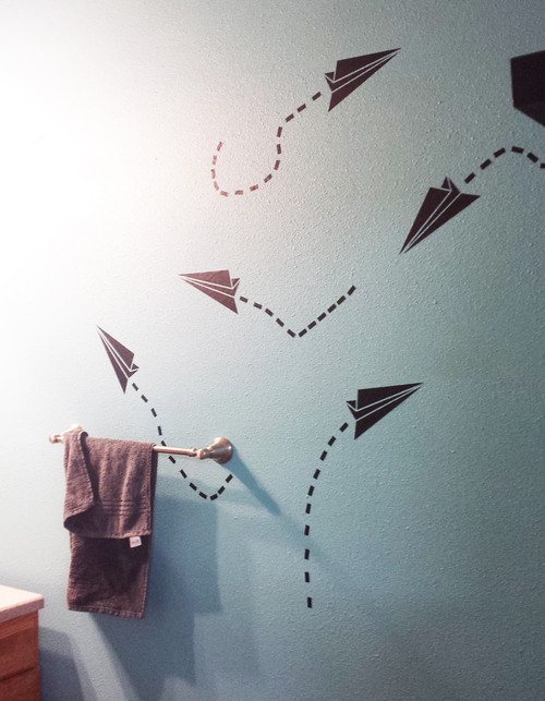 Paper Airplanes Vinyl Wall Sticker Decals for Boys Bedroom or Playroom — Black paper airplane decals on a light blue wall,