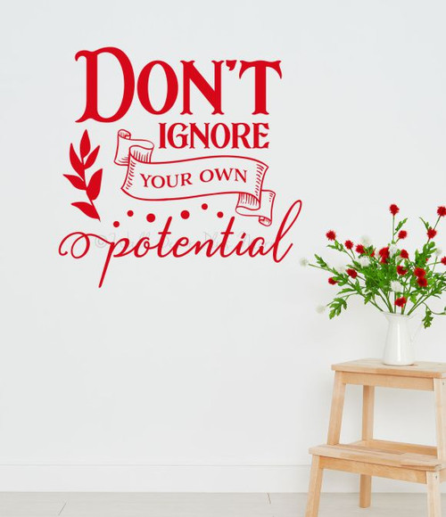 Inspirational Wall Quotes Decal Don't Ignore Potential Office Decor — Red motivational wall decal on white wall above wooden