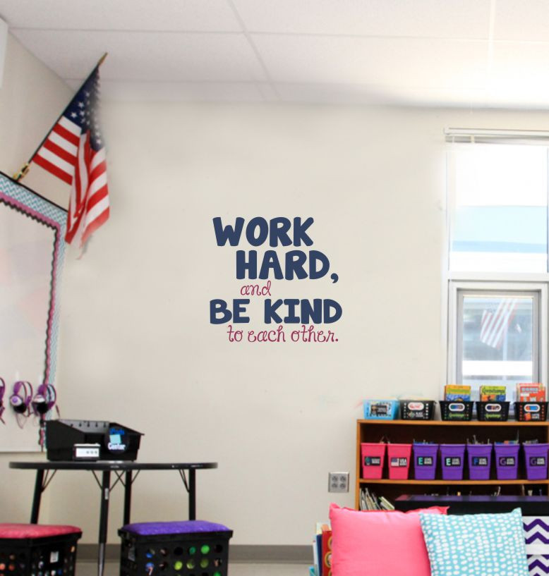 Work Hard Be Kind To Each Other decal in a classroom with student desks