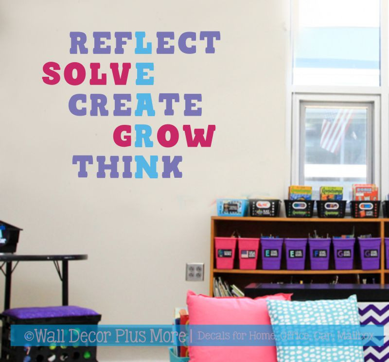 Reflect Solve Create Grow Think word art on a classroom wall above storage bins
