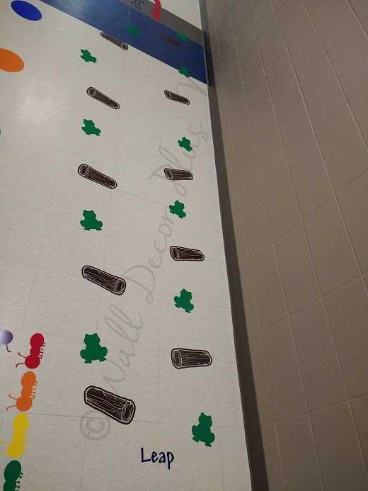 Leap frog and logs sensory path floor decals for a school hallway