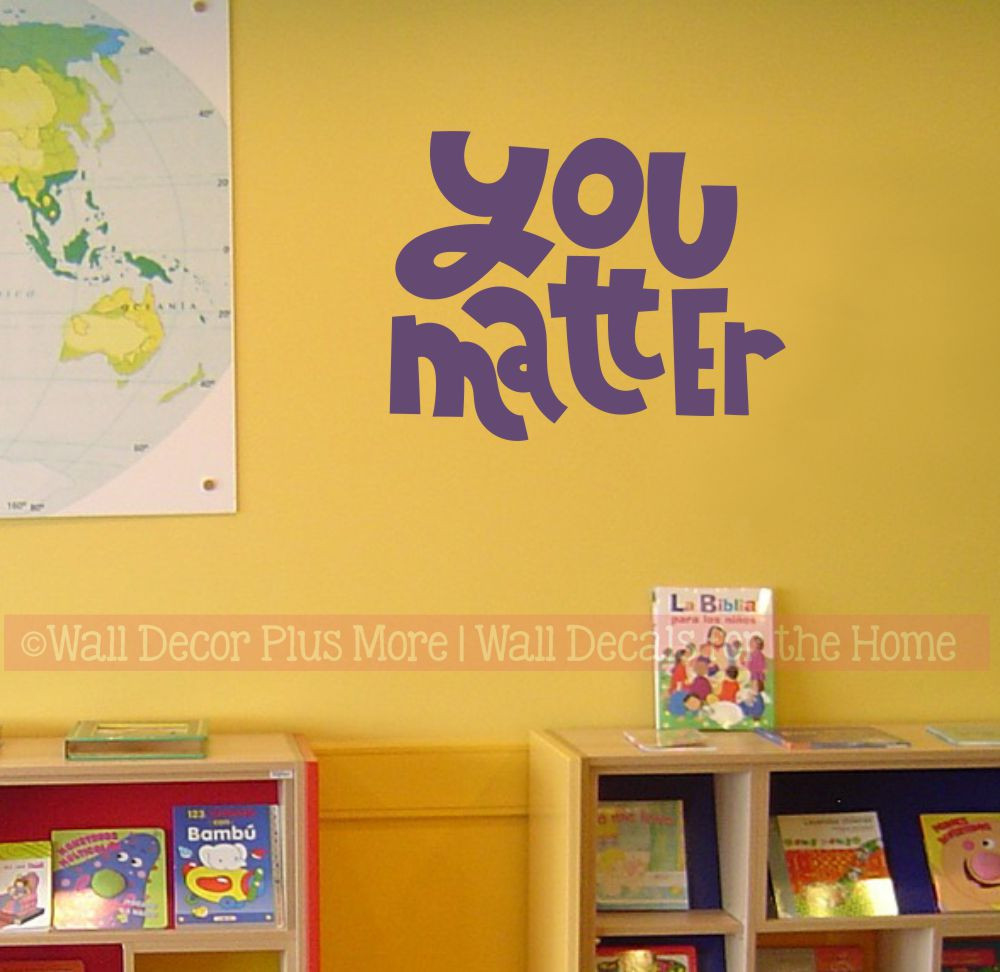 You Matter affirmation decal on a classroom wall beside book bins and a map