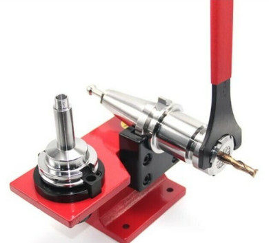 EMG Precision BT40 Tool Holder Fixture showing BT Tool Holder in horizontal position with spanner.