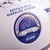 Close-up of the embossed Highmark Stadium 2026 inaugural season emblem and Buffalo Bills logo on the football.