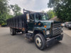 FORD L7000 Single Axle Dump 22' Rack Body, Cummins 12V-5.9 230hp, Equipped w/Side Tool Box, Runs Great - Real Clean   FORD L7000 Single Axle Dump 22' Rack Body, Cummins 12V-5.9 230hp, Equipped w/Side Tool Box, Runs Great - Real Clean