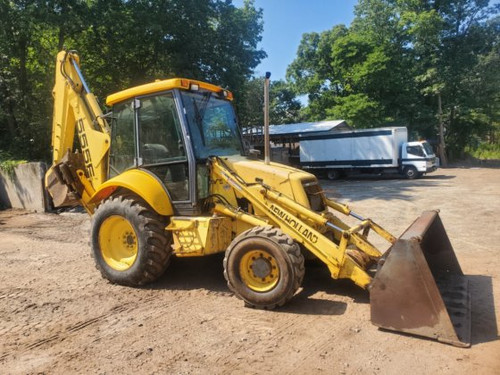 2000 New Holland 555E Rubber Tire Backhoe Loader 2000 New Holland 555E Rubber Tire Backhoe Loader