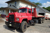 1985 R Model Mack Roll Off tandem-axle truck