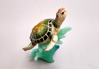 Green Sea Turtle Figurine Riding A Wave (One figure approx. 5+ inches long) Wonderful sea life décor for your home or office! Copyright 2025 SeaShellSupply.com.