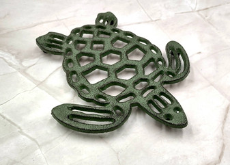 Cast Iron Sea Turtle Green Metal Trivet (1 trivet approx. 7+ inches wide) Green Metal Sea Turtle Trivet adds coastal charm & protection! Copyright 2025 SeaShellSupply.com.