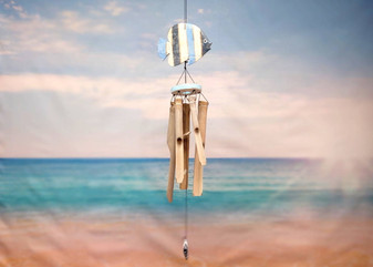 Hanging Wooden Fish Bamboo Windchime (1 Chime approx. 28 x 6.5 inches) Painted fish bamboo windchime brings beachside charm to any home! Copyright 2025 SeaShellSupply.com.