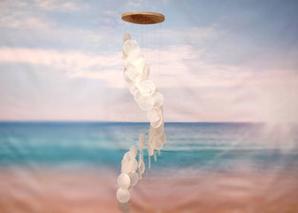 Circle White Spiral Stairway Capiz Shell WInd Chime (1 Chime approx. 31 x 5.5 inches) White Spiral Chime brings beachside charm to any home! Copyright 2025 SeaShellSupply.com.\n\n