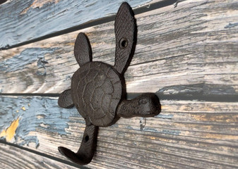 Dark Rust Cast Iron Sea Turtle Wall Hook (1 cast iron hook approx. 6+ inches) Dark Patina Sea Turtle Wall Hanger for coastal home decor! Copyright 2025 SeaShellSupply.com.