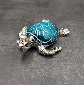 Silver Blue Sea Turtle Resin Painted Figurine (1 turtle approx. 3+ inches) Resin Silver Blue Sea Turtle Figure for gifting décor & display! Copyright 2025 SeaShellSupply.com.