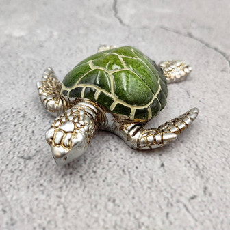Silver Green Sea Turtle Resin Painted Figurine (1 turtle approx. 3+ inches) Resin Silver Green Sea Turtle Figure for gifting & display! Copyright 2025 SeaShellSupply.com.