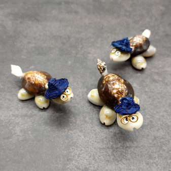 Cowrie Shell Sea Turtle Figurines Dark Blue Hat (3 figures approx. 2+ inches) Cute Cowrie Seashell Sea Turtles for gifts decor & display! Copyright 2025 SeaShellSupply.com