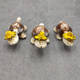 Cowrie Shell Sea Turtle Figurines Yellow Hat (3 figures approx. 2+ inches) Cute Cowrie Seashell Sea Turtles for gifts decor & display! Copyright 2025 SeaShellSupply.com