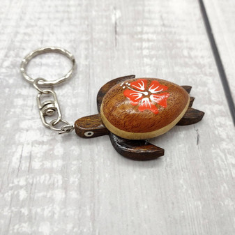 Orange Hibiscus Painted Wooden Sea Turtle Keychain (1 keychain approx. 4.25+ inches) Wooden Sea Turtle Key Fob for gifting or party favors! Copyright 2025 SeaShellSupply.com.