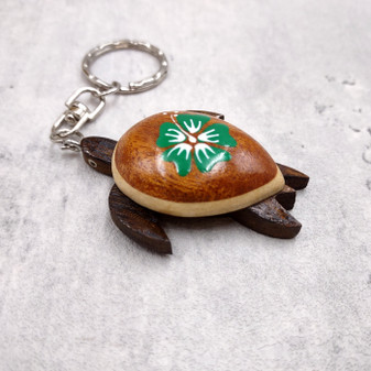 Green Hibiscus Painted Wooden Sea Turtle Keychain (1 keychain approx. 4.25+ inches) Wooden Sea Turtle Key Fob for gifting or party favors! Copyright 2025 SeaShellSupply.com.