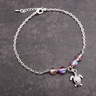 Sea Turtle Anklet Light Pink Beads Silver Color (approx. 9+ inches AROUND) Cute Pink Sea Turtle Charm Anklet for any beachy outfit! Copyright 2025 SeaShellSupply.com.