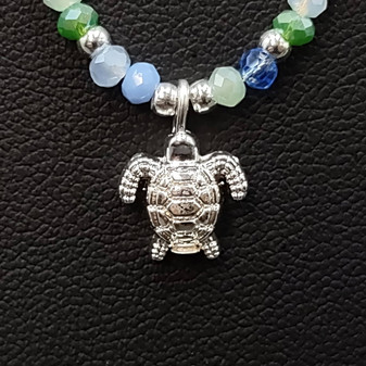 Sea Turtle Charm Necklace Blue Green White Beads Silver Color (approx. 14+ inches AROUND) Sea Turtle Necklace Jewelry for seaside wear! Copyright 2025 SeaShellSupply.com.