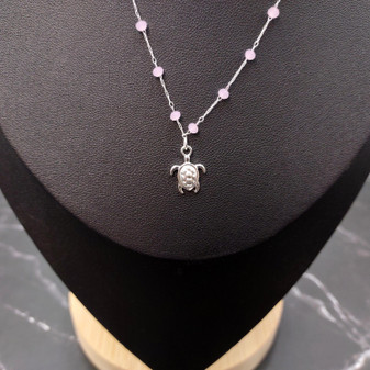Sea Turtle Charm Necklace Delicate Pink Beads Silver Color (approx. 14+ inches AROUND) Silver Sea Turtle Charm Necklace for resort wear! Copyright 2025 SeaShellSupply.com.
