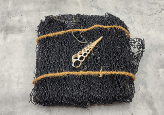 Fishing Net - Used (4 X 9 feet). One black tied fishing net that comes folded and banded. Copyright 2022 SeaShellSupply.com.