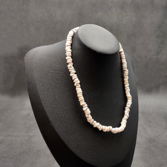 Tiger Puka Shell Necklace (16" x 5-6mm). Two white shell necklaces. Copyright 2026 SeaShellSupply.com.