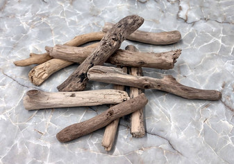 Driftwood Drilled Pieces (10 pieces approx. 3-5 inches). Multiple different wood parts with drilled holes, appear smooth. Copyright 2022 SeaShellSupply.com