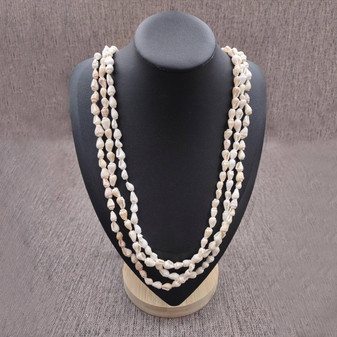 White Nassa Shell Leis (3 Leis Approx. .25 x 28 Inches). White little shells strung through string. Copyright 2026 SeaShellSupply.com.