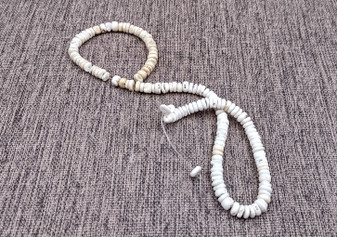 White Puka Style Seashells Drilled Strand (1 strand approx. 16 inches x 4-5+ mm) Copyright 2024 SeaShellSupply.com